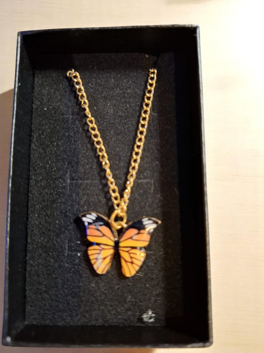 🦋 Fladderketting – Met een vrolijk oranje vlindertje om je nek! ✨