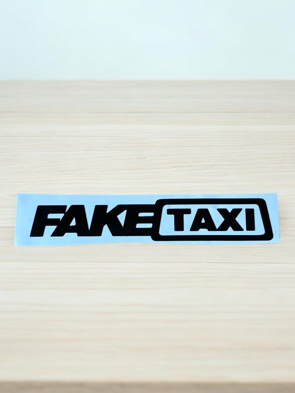 Fake Taxi Sticker – Humor met een knipoog!